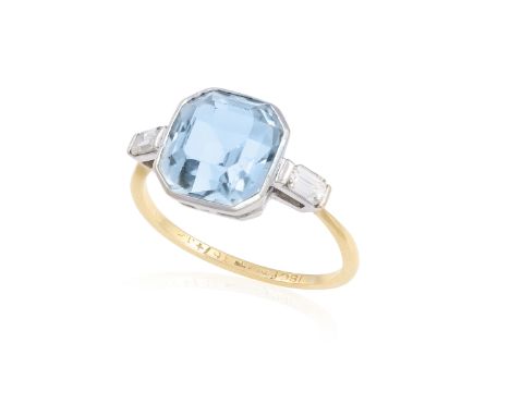 AN AQUAMARINE AND DIAMOND RING The octagonal step-cut aquamarine within collet-setting, between cut-cornered rectangular step