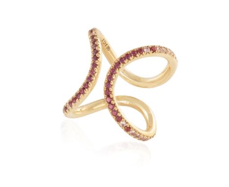 A COLOURED SAPPHIRE AND GARNET 'ME' RING, BY JULIE GENET Of abstract design set with a continuous line of circular-cut pink a