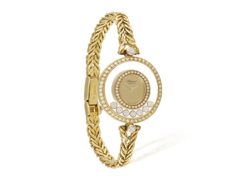 A LADY'S 18K GOLD AND DIAMOND 'HAPPY DIAMONDS' WATCH, BY CHOPARD The 4-jewel quartz ETA-movement 201001, oval-shaped champagn