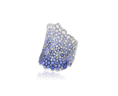 A SAPPHIRE AND DIAMOND 'KANAWAGA' RING, BY JULIE GENET Of scalloped design, set throughout with brilliant-cut diamonds and a 