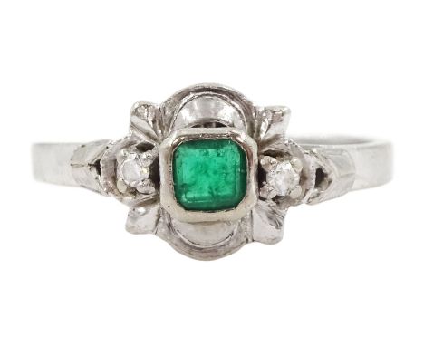 18ct white gold three stone emerald and diamond ring, stampedCondition Report:Approx 3.0gm, size K-L, band misshapen, emerald