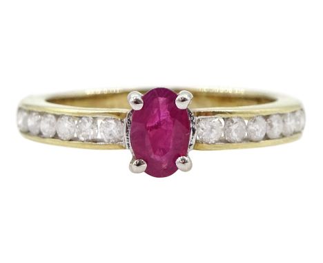 Gold oval ruby ring, with channel set round brilliant cut diamond shoulders, hallmarked 9ctCondition Report:Approx 2.65gm, si