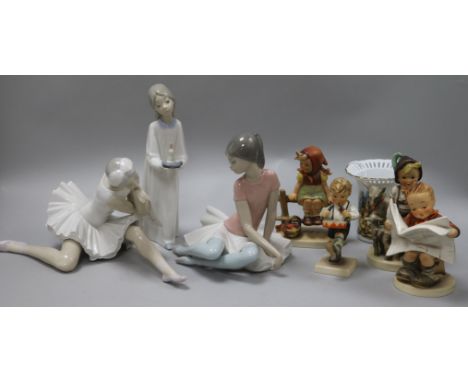 Two Lladro figures of ballerinas, another of a child with candle, four Goebel figures of children, various and a Hummel vase