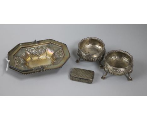 A 19th century silver snuff box, a pair of George III silver bun salts and a later silver sweetmeat basket.