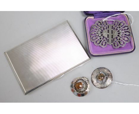A silver engine-turned cigarette case, a Scottish silver cairngorm-set brooch, a similar brooch set hardstones and a silver b