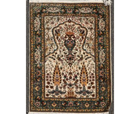 A Persian blue ground carpet, with central medallion in a field of scrolling foliage, 13ft 1in by 9ft 8in.