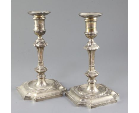 A pair of 1930's 18th century style silver candlesticks, with waisted knopped stems, Hawksworth, Eyre & Co, Birmingham, 1935,