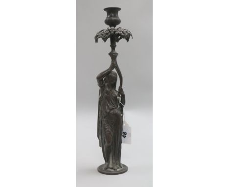 A figural candlestick