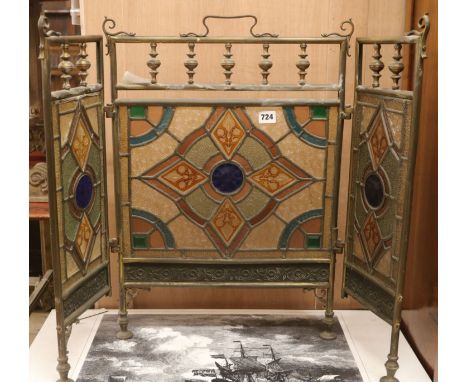 A 3 fold stained glass brass firescreen H.63cm