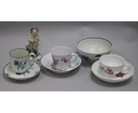 A Derby putto, a Worcester cup and saucer, a Berlin cup and saucer and three other items
