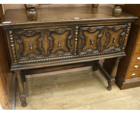 A Jacobean oak side cabinet, W.107cm