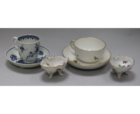 A 1st period Worcester blue and white cup and saucer, a KPM cup and saucer and a pair of Dresden shell salts (6)