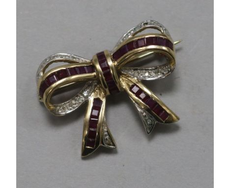 A 9ct gold ruby and diamond set ribbon bow brooch, 27mm.