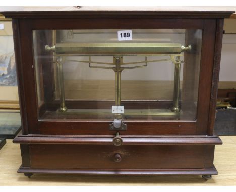 A set of mahogany cased brass beam scales