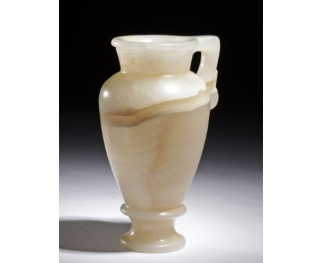 Graeco-Egyptian, ca. 6th to 5th century BCE. Expertly carved from beautiful banded alabaster, an elegant vessel presenting an