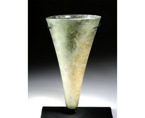 Roman, Eastern Roman Empire, late Imperial Period, ca. 4th century CE. A fabulous oil lamp of a conical form, free-blown from