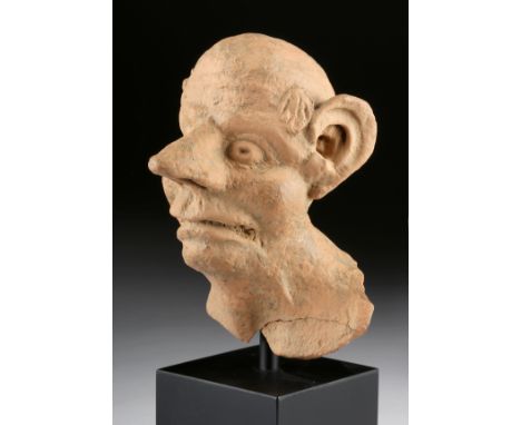 Greece, Hellenistic period, ca. late 4th to 2nd century BCE. A charming head, neck, and partial chest of a "grotesque" figure