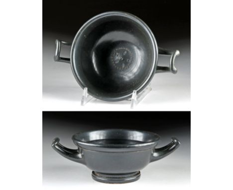 Ancient Greece, Athens (Attic), ca. 5th century BCE. A finely-executed blackware skyphos with a rounded body, standing upon a