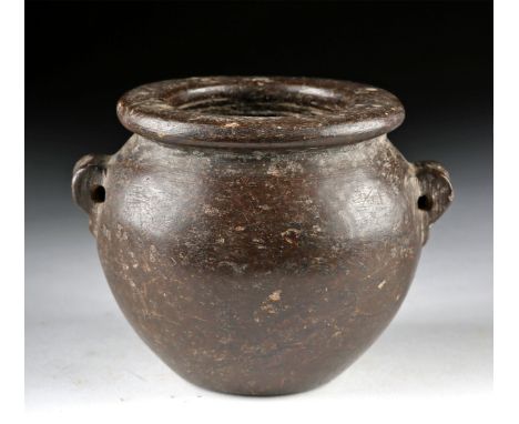 Ancient Egypt, Pre-Dynastic Period, Naqada II, ca. 3400 to 3200 BCE. A stunning jar of a squat size, hand-carved from mottled