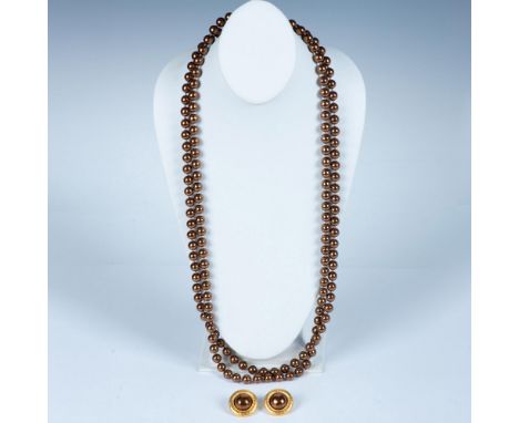 Fabulous long elegant strand of faux bronze color pearls. The strand is long enough to double or even triple. The pearls are 