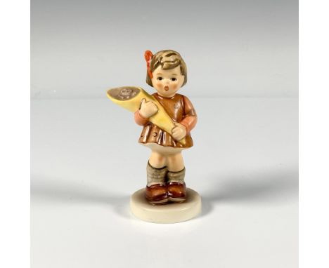 A small hand painted figure of a sweet young girl holding a bouquet. M.I. Hummel Club. Goebel backstamp. This item has its or