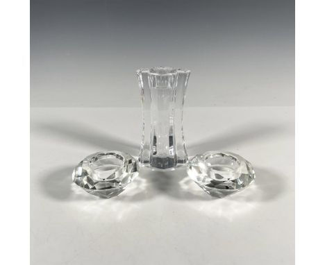 This brilliant grouping features a modern-styled candle holder by Orrefors, accompanied by two complementary shorter votive c