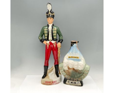 Historical decanters for whiskey and liqueur. Soldier in period dress, colored in black helmet hat, green jacket and red pant