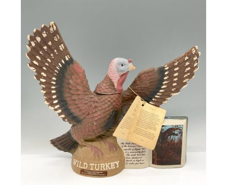 Limited edition bottle is the first of a new series of Wild Turkey Decanters. Colored in brown, red, cream and gray. Brief hi