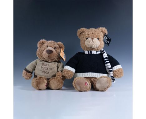 Adorable duo of soft bears dressed in knitted sweaters. One bear is accessorized with a Piano scarf and its a limited edition