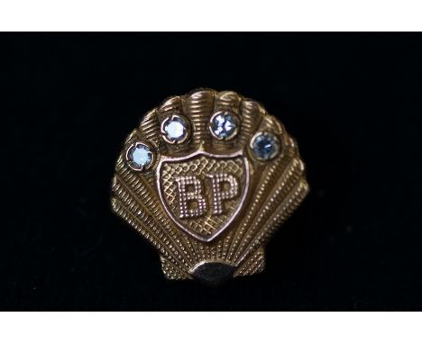 9ct Gold BP badge with 4 diamonds Weight 5.5g