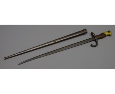 19th century French bayonet, 49cm blade indistinctly inscribed and stamped, shaped wooden handle, L61cm, scabbard stamped 838