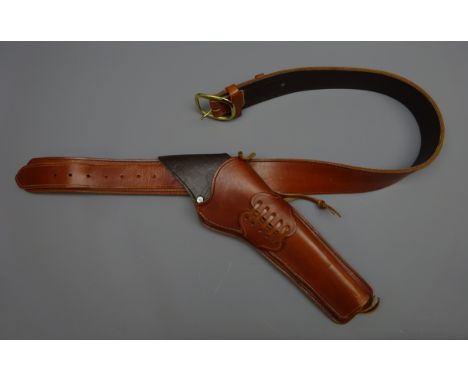 Hand made brown leather cross draw single gun rig, plain stitched belt with brass buckle, L110cm Condition Report Click here 