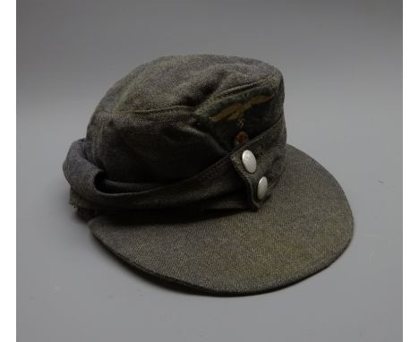 WW2 German Luftwaffe M-43 field cap, blue wool with one piece eagle and cockade insignia, two button front, cloth lined inter