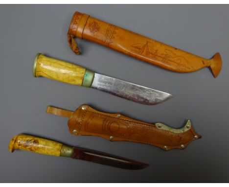 Two Finish hunting knives, 15.5cm single edge blade engraved J Marttini 14.5cm with sledding scene, another, blade engraved T