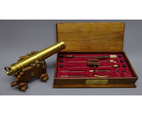 Brass and wood hand crafted Crysalis model of a c1850 Garrison Gun, on wheeled carriage with set of tools in fitted oak case 