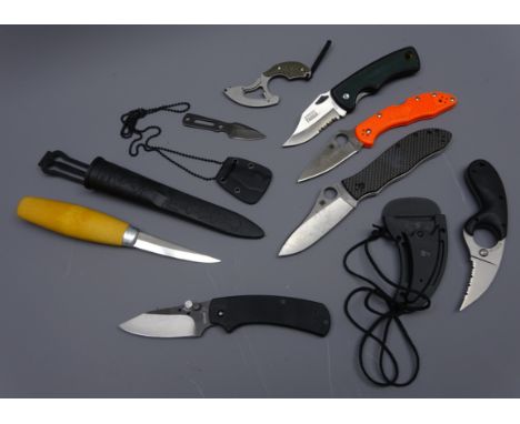 Collection of various knives including Erik Frost Mora woodcarving knife with wooden handle in plastic sheath, two Spyderco l