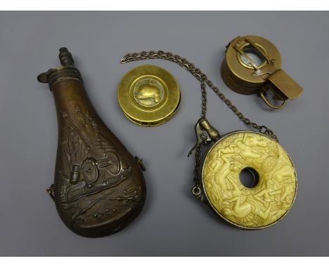 Victorian brass powder flask embossed with battle trophies H22cm, reproduction powder flask of ring form moulded with naked l