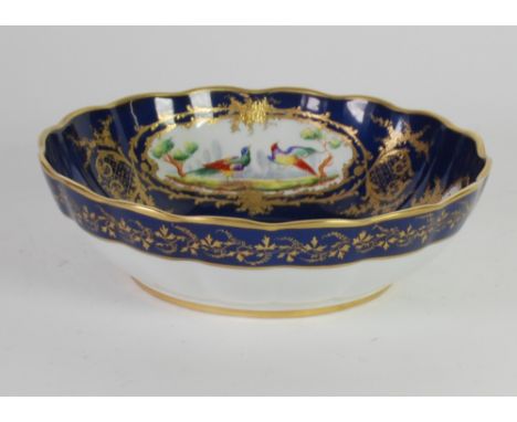 A POST WAR, ATELIER TALLEC, PARIS DECORATED LIMOGES PORCELAIN SHALLOW BOWL IN THE SEVRES STYLE, the Royal blue ground reserve