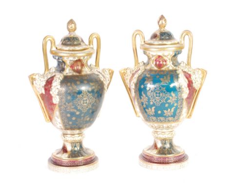 PAIR OF 20th CENTURY 'VIENNA' PORCELAIN TWO HANDLED PEDESTAL VASES AND COVERS, each of typical form with high scroll gilt han