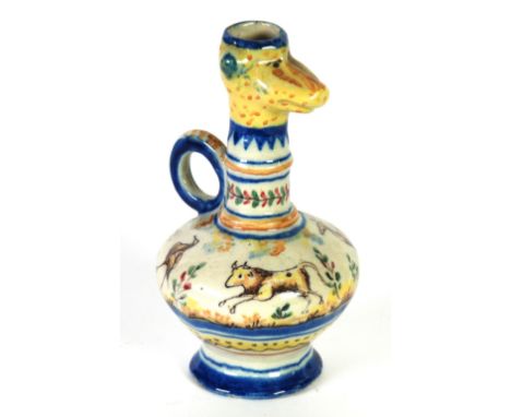 CONTINENTAL FAIENCE POTTERY JUG, of footed bulbous form with loop handle and animal mask pattern top, painted in the maiolica