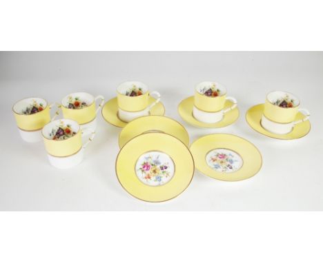 SET OF SIX MODERN ROYAL WORCESTER 'MIRANDA' PATTERN CHINA COFFEE CANS AND SAUCERS, each with floral painted centre and yellow