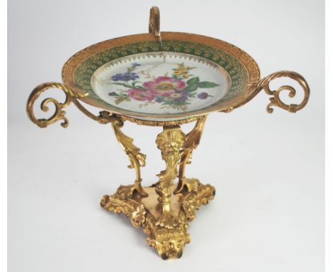 20th CENTURY LIMOGES, FRENCH PORCELAIN AND GILT BRASS ORNATE TABLE CENTRE PIECE the plate with floral painted centre and gree