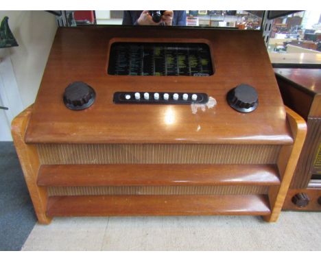 A Murphy U128 push button eight waveband valve radio in walnut veneered wooden case, serial number 291190. C.1948 