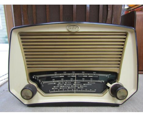 A GEC model BC6447 five valve table top radio in black Bakelite casing with cream front and gold coloured speaker grille and 