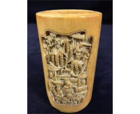 A carved ivory item, Oriental