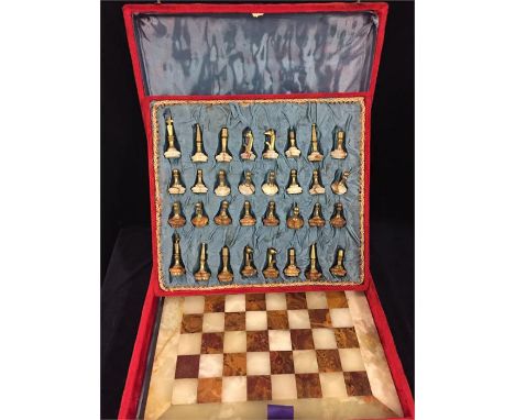 Polished stone and brass chess set and board