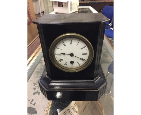 Attractive simple mantle clock with enamel face, in a black painted wooden case.  Labelled inside the door by Albert C. Keen 