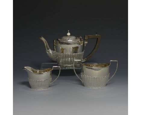 An Edwardian silver 'Bachelor's' Tea Set, by&nbsp;Horace Woodward &amp; Co Ltd., hallmarked Birmingham, 1903, of oval form wi