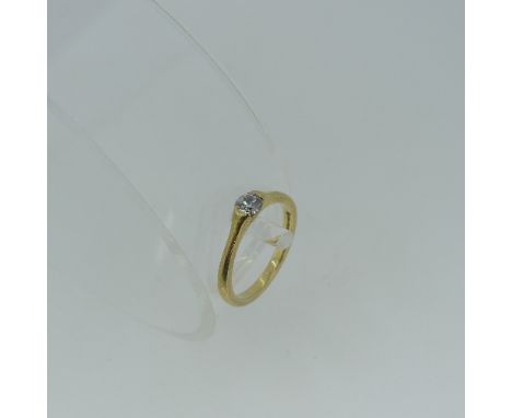 A singe stone diamond Ring, the brilliant cut stone 0.27ct, all mounted in 18ct yellow gold, Size O, total weight 3.6g. 