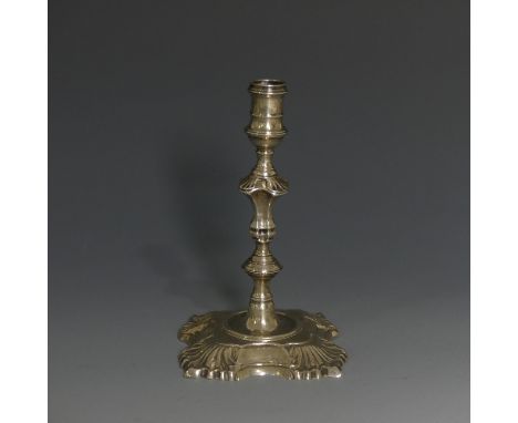 A George II silver Taper Stick, by&nbsp;James Gould, hallmarked London, 1746, with a shell capped shaped square base and knop